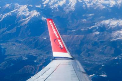 Norwegian ut mot lange køer: Vurderer å trappe ned